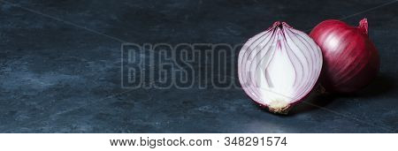 Red Onion On Dark Background. Copy Space