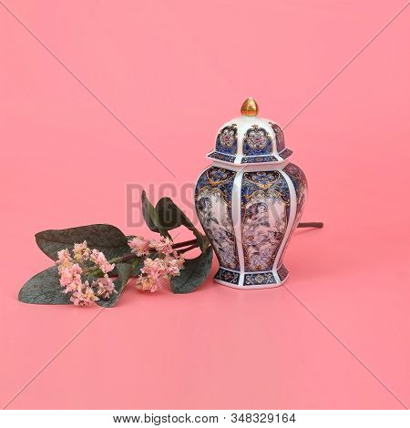 Classic Oriental Vase With Jasmine Branch Isolated On Pink (coral) Background