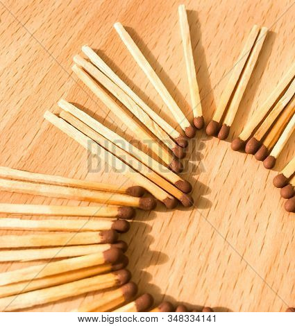Wooden Safety Matches On A Wooden Background Arranged In The Shape Of A Heart. Matchsticks In The Sh