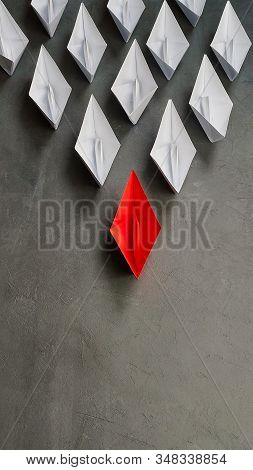 Business Concept, Paper Boat, The Key Opinion Leader, The Concept Of Influence. One Red Paper Boat A