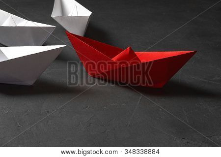 Business Leadership Concept, Paper Boat, The Key Opinion Leader, The Concept Of Influence. One Red P