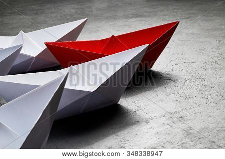 Business Concept, Paper Boat, The Key Opinion Leader, The Concept Of Influence. One Red Paper Boat A
