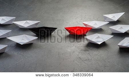Opportunities Business Concept Key Opinion Leader, Influence Concept. One Black Paper Boat As A Lead