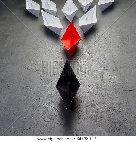 Opportunities Business Conceptkey Opinion Leader, Influence Concept. One Black Paper Boat As A Leade