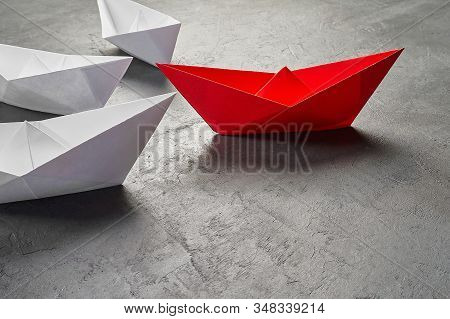 Business Leadership Concept, Paper Boat, The Key Opinion Leader, The Concept Of Influence. One Red P