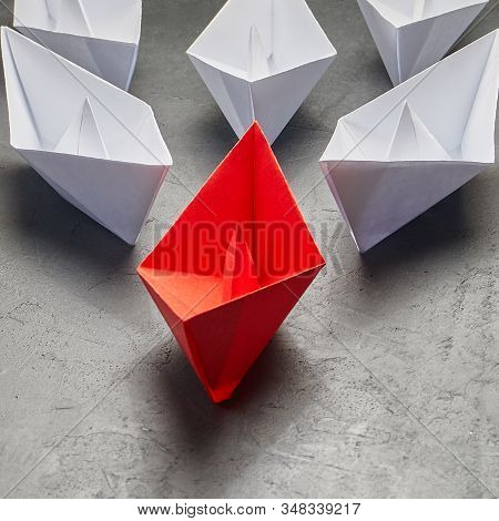 Business Leadership Concept, Paper Boat, The Key Opinion Leader, The Concept Of Influence. One Red P