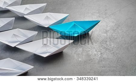 Business Concept, Paper Boat, The Key Opinion Leader, The Concept Of Influence. One Blue Paper Boat 