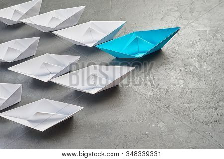 Business Concept, Paper Boat, The Key Opinion Leader, The Concept Of Influence. One Blue Paper Boat 