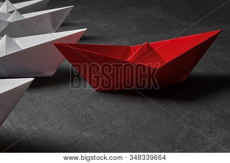 Business Concept, Paper Boat, The Key Opinion Leader, The Concept Of Influence. One Red Paper Boat A