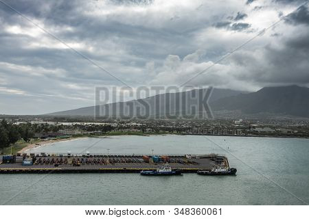 Kahului, Maui,, Hawaii, Usa. - January 13, 2020: 2 Black Mountains Tower Over Cityscape And Pier Ful