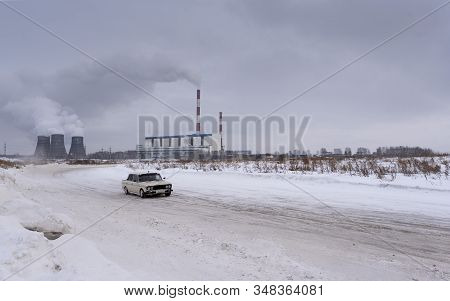 Russia, Novosibirsk - November 30, 2019. An Old Russian White Car Vaz Zhiguli Is Driving Fast, Turni