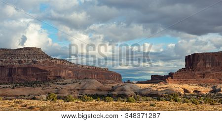 Travel And Tourism Cenes From The Western United States. Red Rock Formations And Dramatic Landscapes
