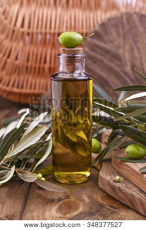 Green Olives In Tin Cans With Loaf Of Fresh Bread And Young Olives Branch , Bottle Of Olive Oil On C