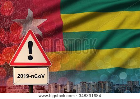 Togo Flag And Coronavirus 2019-ncov Alert Sign. Concept Of High Probability Of Novel Coronavirus Out