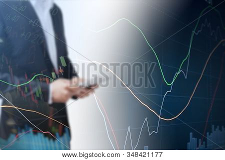 Businessman Using Tablet Analyzing Sales Data And Economic Growth Graph Chart. Business Strategy. Ab