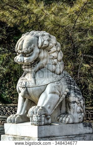 Sculpture In Front Of The Great Chinese Wall In The Mountains Near Bejing