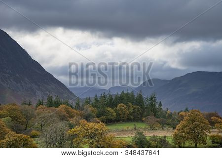 Stunning Autumn Fall Landscape View Along Valley Towards Mellbreak And Grasmoor In Lake District Wit