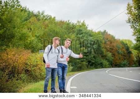 Hitchhiking Gesture. Begin Great Adventure In Your Life With Hitchhiking. Company Friends Travelers 