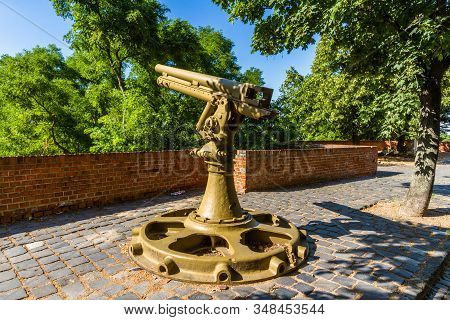 Old Metal Large Gun Painted Brown In Sun.