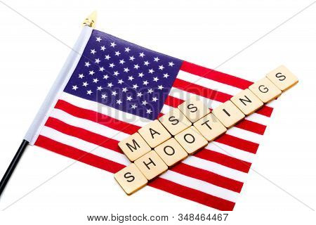 The Flag Of The United States Isolated On A White Background With A Sign Reading Mass Shootings
