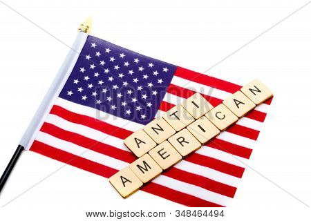 The Flag Of The United States Isolated On A White Background With A Sign Reading Anti American