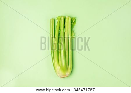 Fresh Bunch Celery On Green Background Top View Horizontal