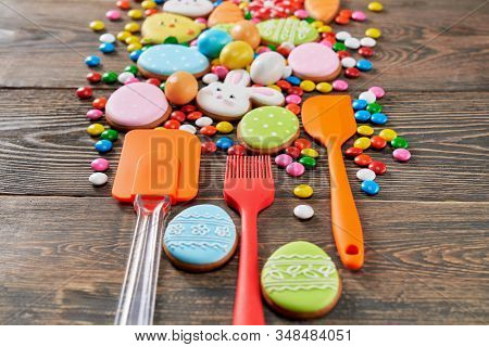 Colorful Ginger Glazed Cookies And Chocolate Balls On Wooden Table. Homemade Lovely Delicious Pastry