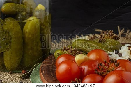View Of A Dish Of Homemade Pickles Of Cucumbers, Tomatoes, Cabbage And Dill Flowers And Part Of A Gl