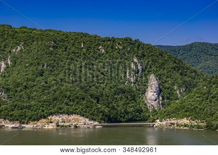 Dubova, Romania - May 8, 2018: Rock Sculpture Of Decebalus In Danube Gorge, Near Dubova, Romania. Sc