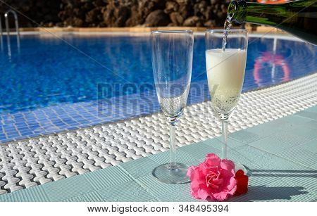 Pool Party With Two Glasses Of Bubbles White Champagne Or Cava Wine, Romantic Event On All Inclusive