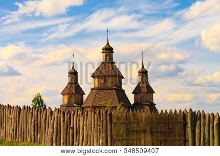 Beautiful Old Wooden Vintage Church On Easter Day, Wooden Fence And Gates. Orthodox Christian Church