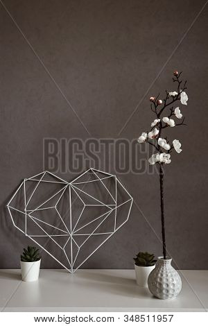 Elegant Heart With Notes On The Background Of A Concrete Wall In The Interior. Minimalism. Concept S