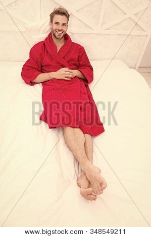 Guy In Bathrobe Relaxing. Maintaining Consistent Circadian Rhythm Essential For General Health. Man 