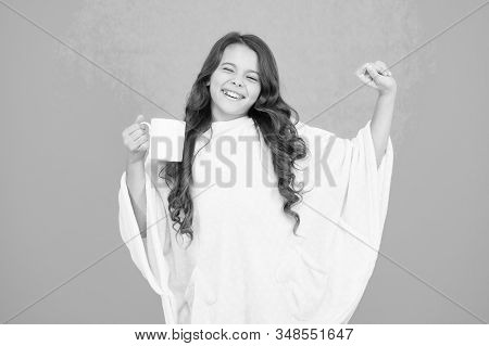 Wellbeing Concept. Little Girl With Long Hair. Feeling Comfy. Adorable Child On Turquoise Background