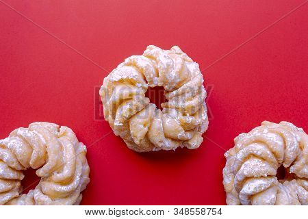 Honey Cruller Donuts On A Red Background