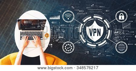 Vpn Concept With Person Using A Laptop On A White Table