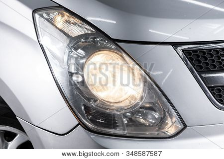 Novosibirsk, Russia - December 18, 2019:  Hyundai Grand Starex,  Macro View Of Modern Red Car Xenon 