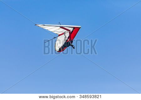 Hang-glider Flying Through The Clear Blue. Hang-gliding Competition In Creston, British Columbia, Ca