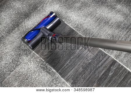 Vacuum Cleaner On The Floor. House Cleaning Concept. Before And After Cleaning. Dirty And Cleaned Ar