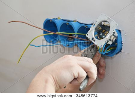Electrican Repair And Installing Socket Boxes, Outlet Plug. Socket Plug And Plastic Socket Boxes Ins