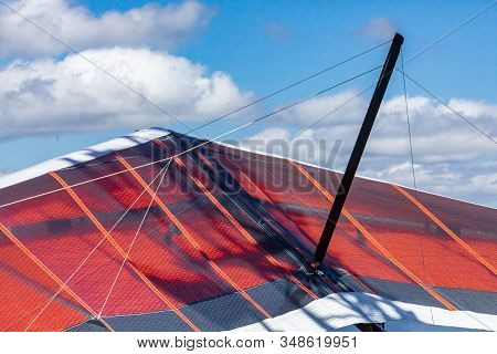 Hang Gliders Ready To Flight. Extreme Lifestyle. Paragliders On The Hilltop. Delta Plane Parked On T