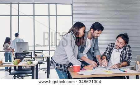 Creative Designe Team Brainstrom Branding Project With Designer Team At Meeting Table With Desktop C