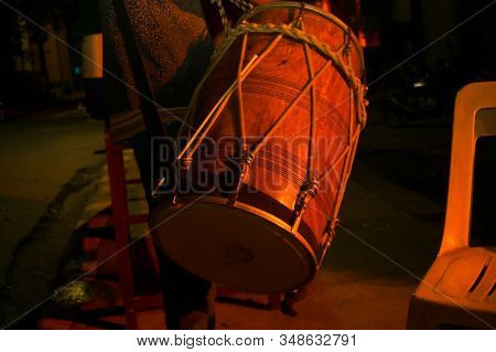 Drum, Dhol Carried Around By A Person At Night