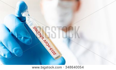 Medical Doctor Or Laborant Holding Tube With Ncov Coronavirus Vaccine For 2019-ncov Virus. Novel Cor