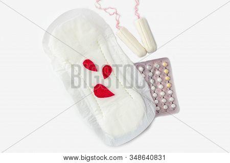 Protective Menstrual Pad With Fabric Blood Drops, Cotton Tampons, Contraceptive Pills On White Backg