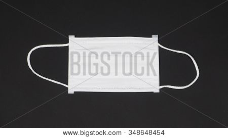 N95 Mask Help To Protect Dust And  Corona Virus Or Other Particle, Put On Black Background.