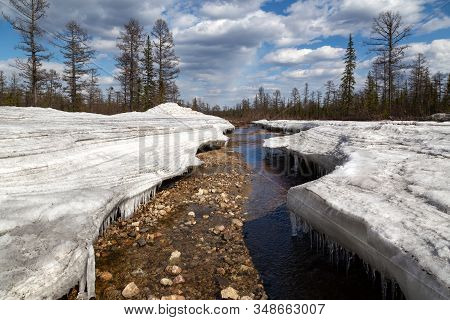 Erode Frazil On A Stream In South Yakutia, Russia, In Springtime