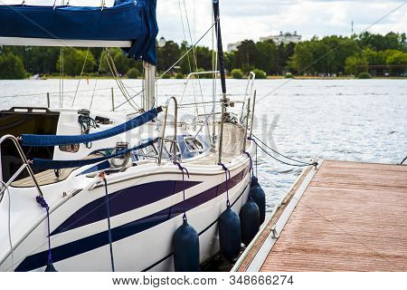A Mooring With A Mooring Line Tied Around It With Boats And Ships In The Background In A Harbour Moo