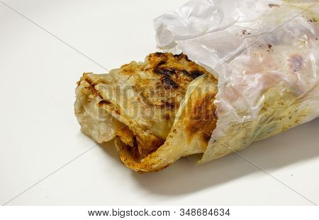 Parotta Roll Which Is A Common Street Food In South India. Partotta Is A Layered Flatbread Made Out 