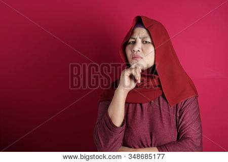 Portrait Of Cynical Asian Muslim Woman With Suspicious Expression Looking At Camera, Mistrust Misdou